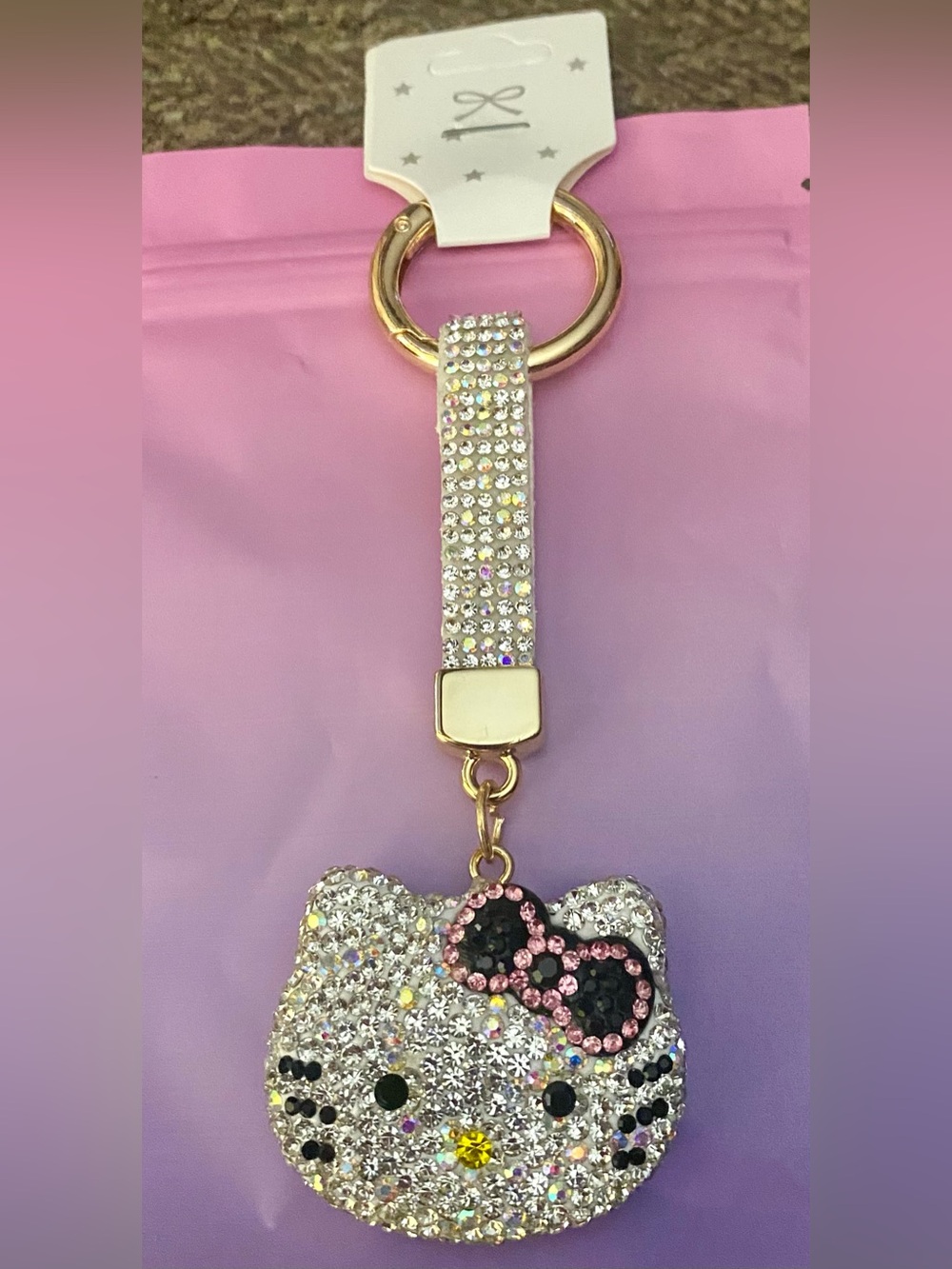 Sanrio Hello Kitty rhinestone face bag charm keychain adorned with pave crystals
